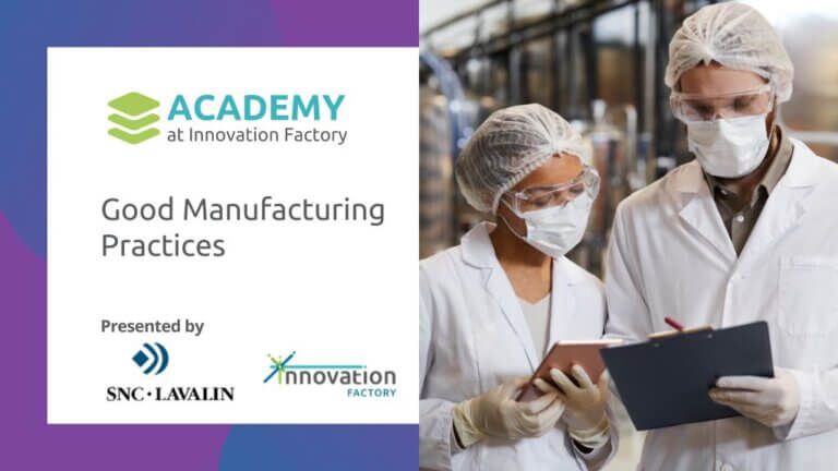 Academy at Innovation Factory: Good manufacturing practices presented by SNC Lavalin. Photo of two medtech scientists wearing labcoats, gloves, hair nets and facemasks in a medical manufacturing facility. One of them is holding a clipboard to discuss process documentation with the other person.